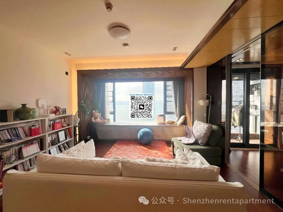 Living room with a pale sofa, shelving and a window seat in the Imperial Park advertiser gallery